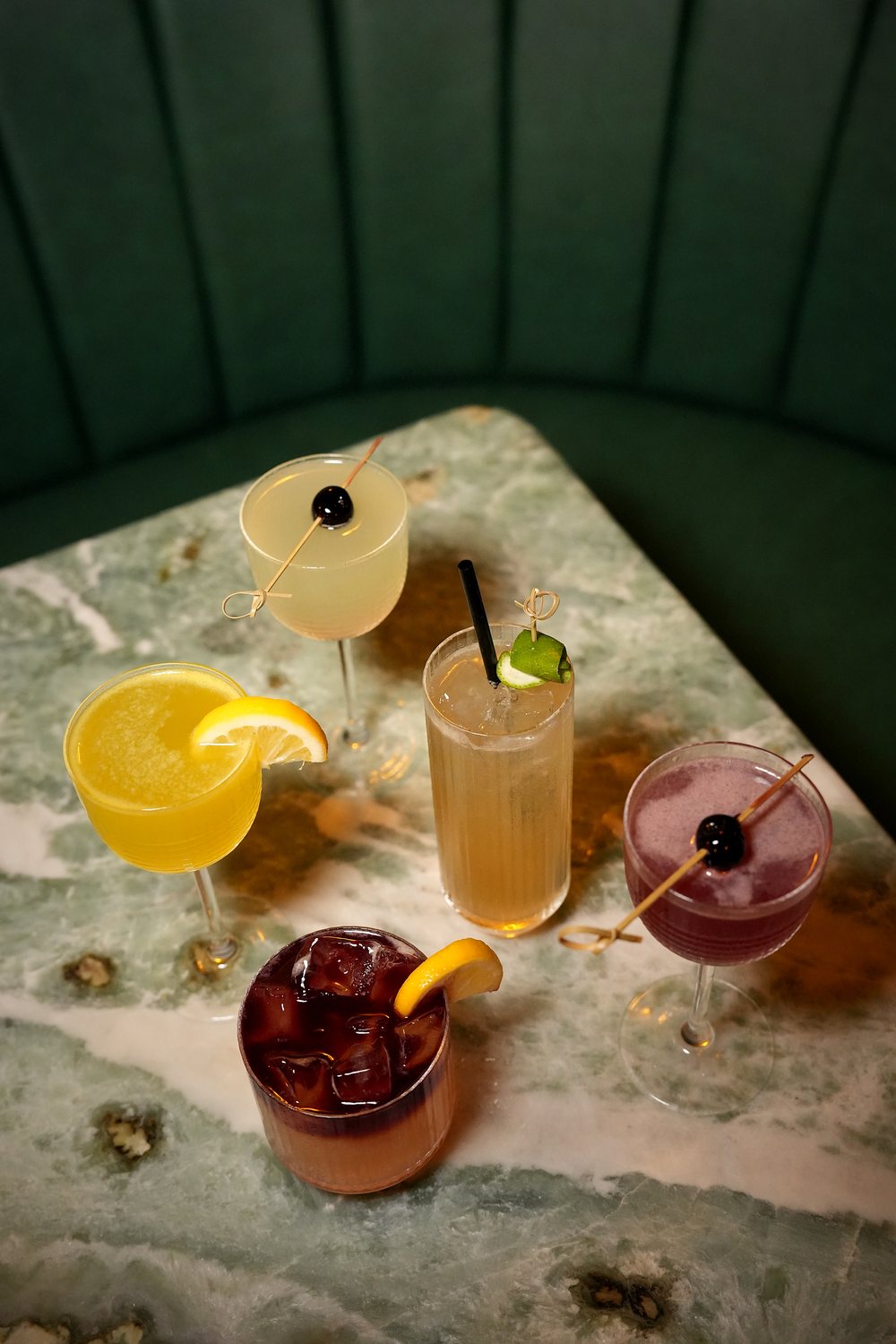 Cocktail lineup on the marble at Susu's